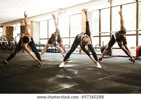 Similar – Foto Bild Starke ethnische Sportlerin trainiert an einem Trainingsgerät in einem modernen Fitnessstudio