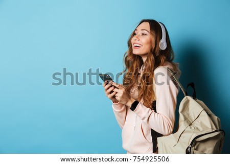 Image, Stock Photo Schoolgirls looking for audio books in school library. Students choosing books. Elementary education. Doing homework. Back to school