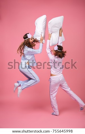 Similar – Image, Stock Photo Pillow fight girl dressed
