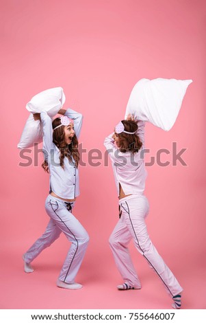 Similar – Image, Stock Photo Pillow fight girl dressed