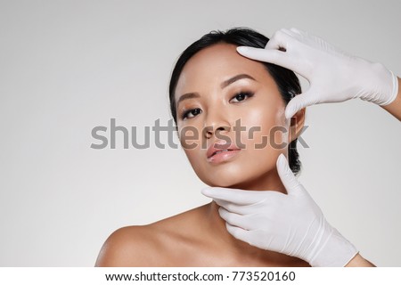 Similar – Image, Stock Photo woman with gloves touching her mask