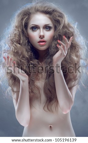 Young innocent woman with curly hair