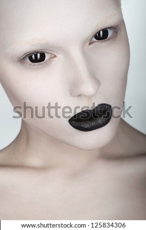 Woman face with white skin and black lips