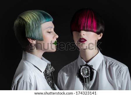 Dark portrait of pale gothic women with creatively dyed hair