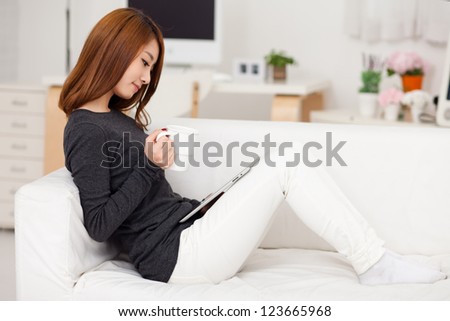 Young Asian woman using a pad PC