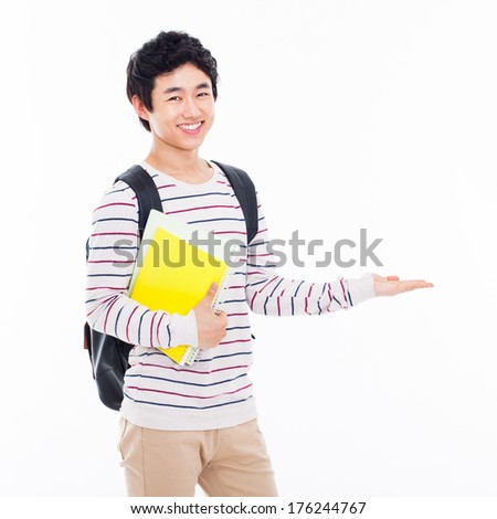 Young Asian student present something isolated on white background.