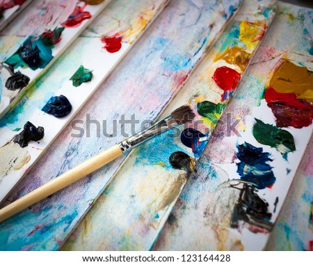 Palette with paint brush and tubes of oil paint