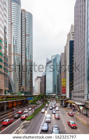HONGKONG, CHINA-MAY 30: Gloucester road, traffic and city life in this Asia international business and financial center. This is one of the most populated area in the world. May 30, 2013 Hong Kong