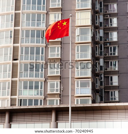 Chinese national flag in front of the building