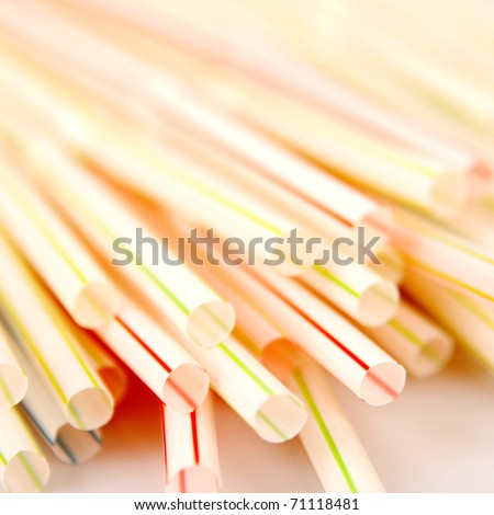 Colorful drinking straws. Close up of colored drinking straws with shallow depth of field on white background.