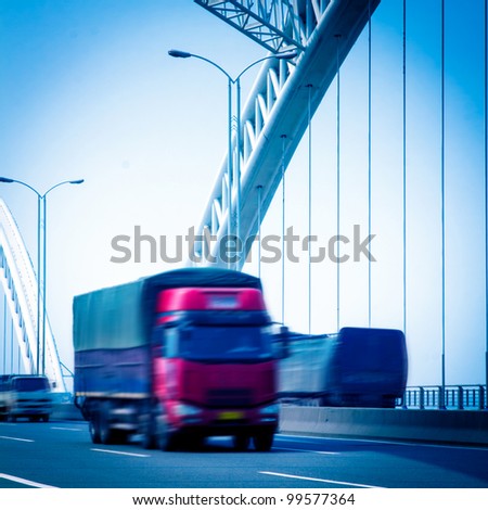 speeding truck go through the bridge.