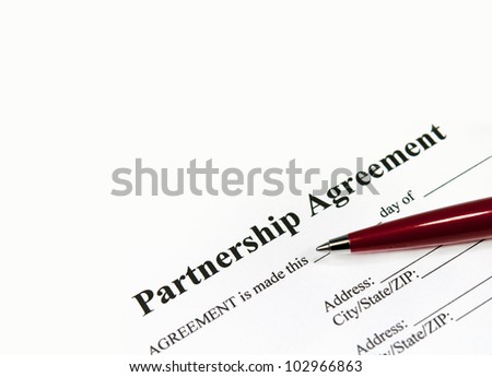 Closeup image of a partnership agreement ready to be filled