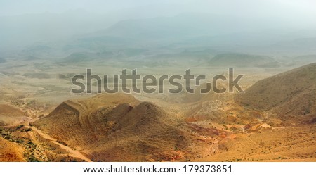 dust storm  in the Large Crater (Makhtesh Gadol) in  Negev desert. Israel