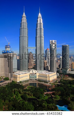 KUALA LUMPUR - NOV 16: The Petronas Twin Towers on November 16, 2010, in Kuala Lumpur, Malaysia are the world\'s tallest twin tower. The skyscraper height is 451.9m