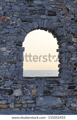 Arch stone window with Mediterranean sea view