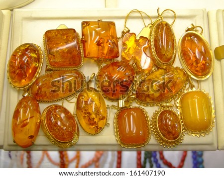 Gem stone pendants made of modified amber and gold