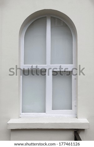 White arch window at simple house