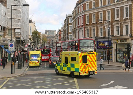 LONDON, UNITED KINGDOM - NOVEMBER 23: Ambulance responder in London on NOVEMBER 23, 2013. Ambulance emergency van at street in London, United Kingdom.