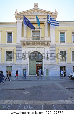 ATHENS, GREECE - MAY 04: National Bank of Greece in Athens on MAY 04, 2015. People in Front of National Bank of Greece Headquaters Building in Athens, Greece.