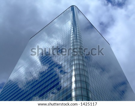 Blue glass square building with round corners