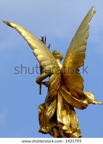 Gold wings on a lady statue