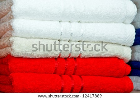 Stack of dry soft towels red and white