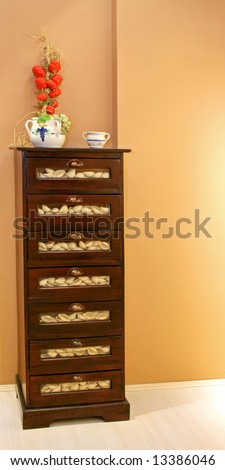 Big wooden drawer cabinet filled with pasta