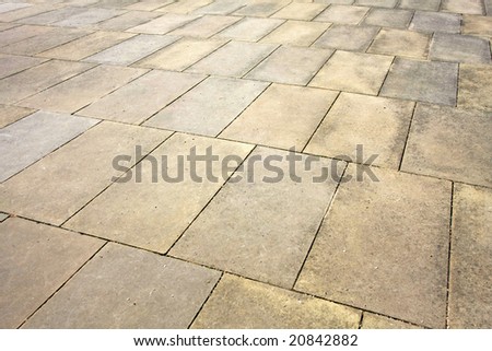 Angle shot of sidewalk pavement plates texture