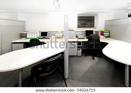 Modern office cubicles divided with folding screens