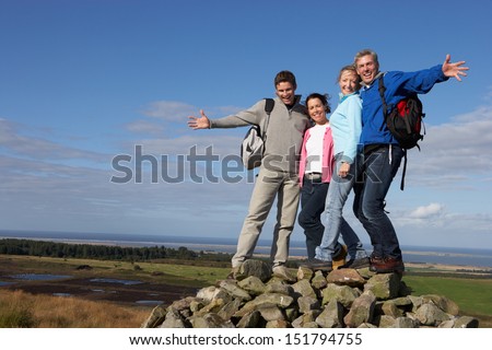 Similar – Image, Stock Photo Four people hiking with fog