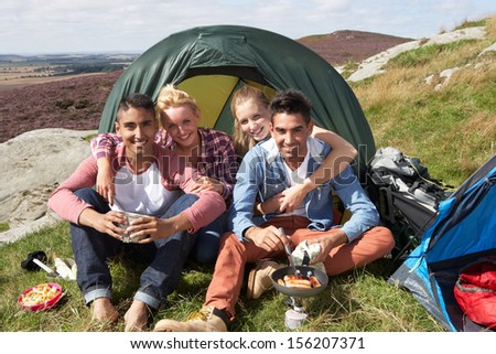 Group Of Young People On Camping Trip In Countryside
