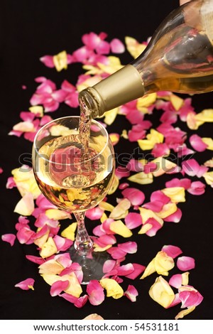 White wine pouring down from a bottle. Good for romantic designs.
