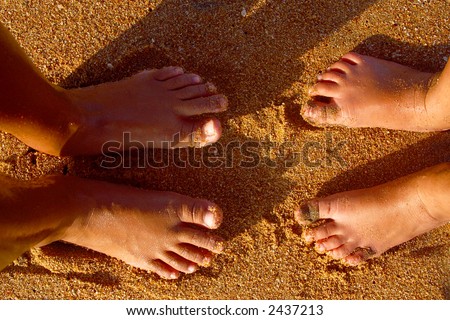 kids showing their feet at the bay of San Agustinillo in the southern state of Oaxaca in Mexico, Latin america