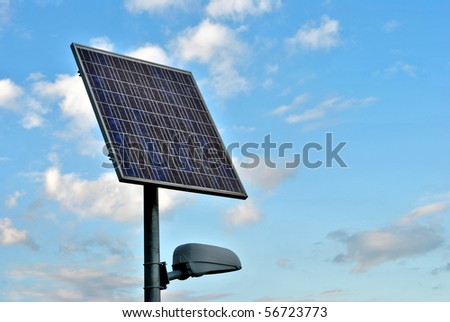 solar panels to produce electricity using the sun\'s rays to illuminate the mountain road