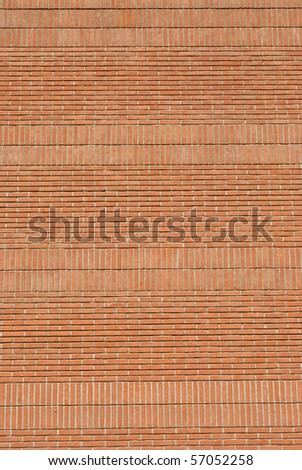 red brick wall with joints in concrete and natural materials and low environmental impact