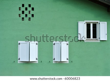 geometric house with windows open and closed