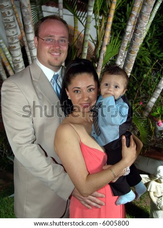 Father, Mother and baby son family portrait with formal attire