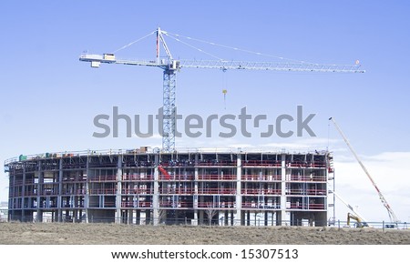 Construction of new office building with a large crane