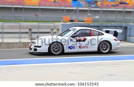 ISTANBUL - MAY 13: Cengiz Oguzhan drives a Porsche 997 GT3 car at pit lane after 2nd race of 2012 Vizio GT3 Challence, Istanbul Park on May 13, 2012 in Istanbul, Turkey.