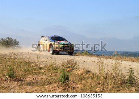ISTANBUL - JUNE 10: Murat Bostanci drives a Castrol Ford Team Turkiye Ford Fiesta S2000 car during 33th Istanbul Rally championship, Yesilvadi Stage on June 10, 2012 in Istanbul, Turkey.