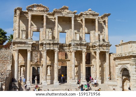 IZMIR, TURKEY - OCTOBER 16: People visit Library of Celsus in Ephesus on October 16, 2013 in Izmir, Turkey. Library of Celsus built in 117 A.D. and one of the most touristy place in Turkey.