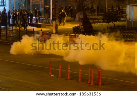 ISTANBUL, TURKEY - MARCH 11, 2014: Police intervene with tear gas in Kadikoy during protest after Berkin Elvan, who was 15 years old, died. He was hit in the head with a tear gas canister by Police