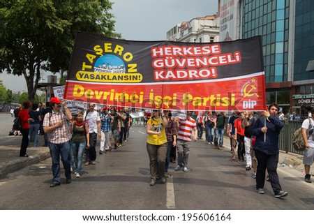 ISTANBUL, TURKEY - MAY 25, 2014: Unions march in protest against subcontractors in Turkey. Subcontracting ban write on banner