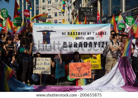 ISTANBUL, TURKEY - JUNE 22, 2014: 5. Trans Pride March held in Istiklal Avenue, Istanbul. We are not patient, not alone, we are here write on banner