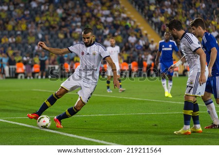 ISTANBUL - AUGUST 08, 2014: Mehmet Topal is stop the ball going out in Fenerbahce vs Chelsea in Soma Charity Tournament in Sukru Saracoglu Stadium.