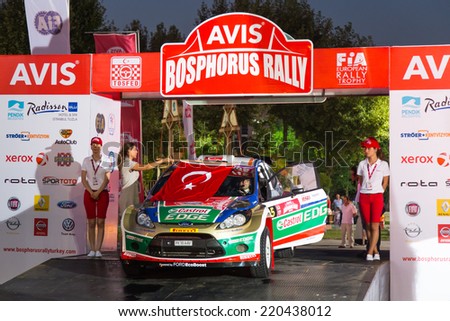 ISTANBUL, TURKEY - AUGUST 15, 2014: Fatih Kara with Fiat Abarth Punto S2000 car of Pegasus Racing Team in ceremonial start of Avis Bosphorus Rally