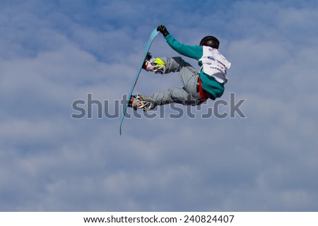 ISTANBUL, TURKEY - DECEMBER 20, 2014: Jan Scherrer jump in FIS Snowboard World Cup Big Air. This is first Big Air event for both, men and women.