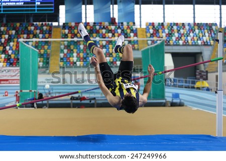ISTANBUL, TURKEY - JANUARY 17, 2015: Athlete Alperen Acet high jump during Ruhi Sarialp clubs jumping championship and athletics record attempt races in Asli Cakir Alptekin Athletics hall