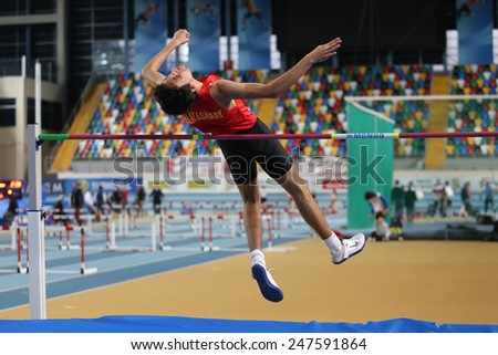 ISTANBUL, TURKEY - JANUARY 24, 2015: Athlete Huseyin Alper Gurses high jump during Turkish Athletic Federation Indoor Athletics Competition in Asli Cakir Alptekin Athletics hall