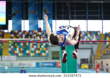 ISTANBUL, TURKEY - FEBRUARY 21, 2015: Moldovan athlete Andrei Miticov high jump during Balkan Athletics Indoor Championships in Asli Cakir Alptekin Athletics hall.
